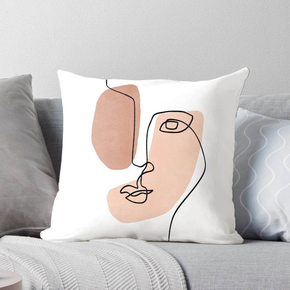 Minimalist abstract face design printed on a decorative throw pillow
