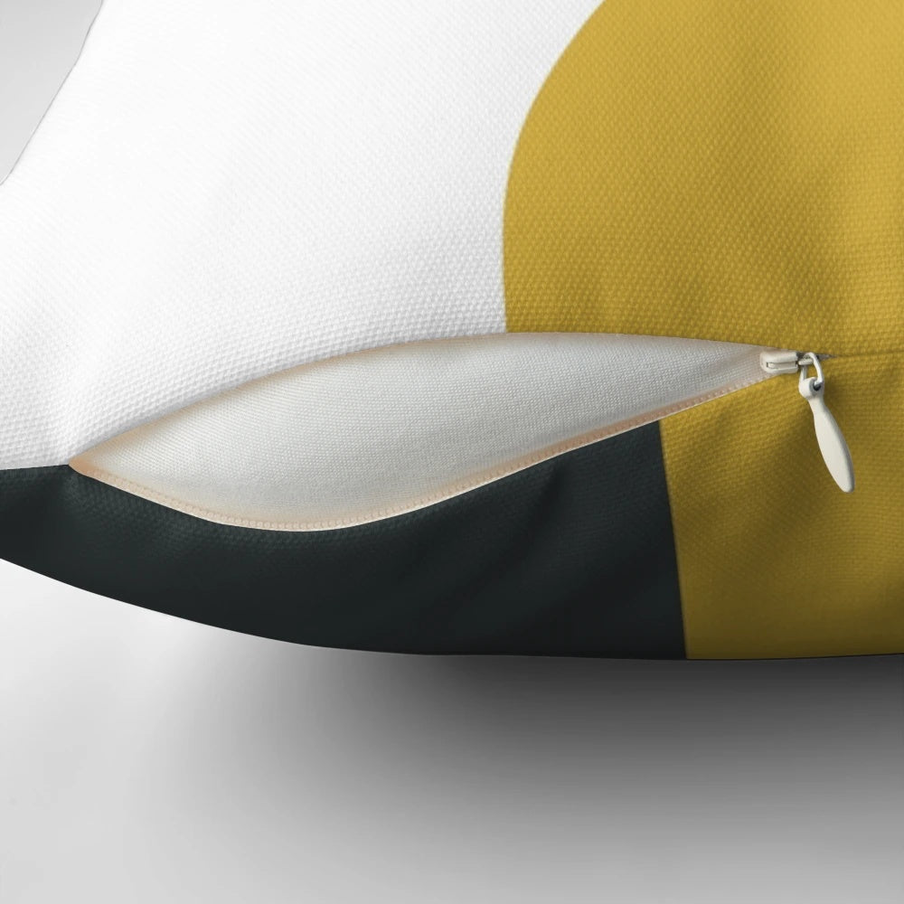 Minimalist abstract geometric pattern pillow in navy blue, light mustard yellow, and white colors