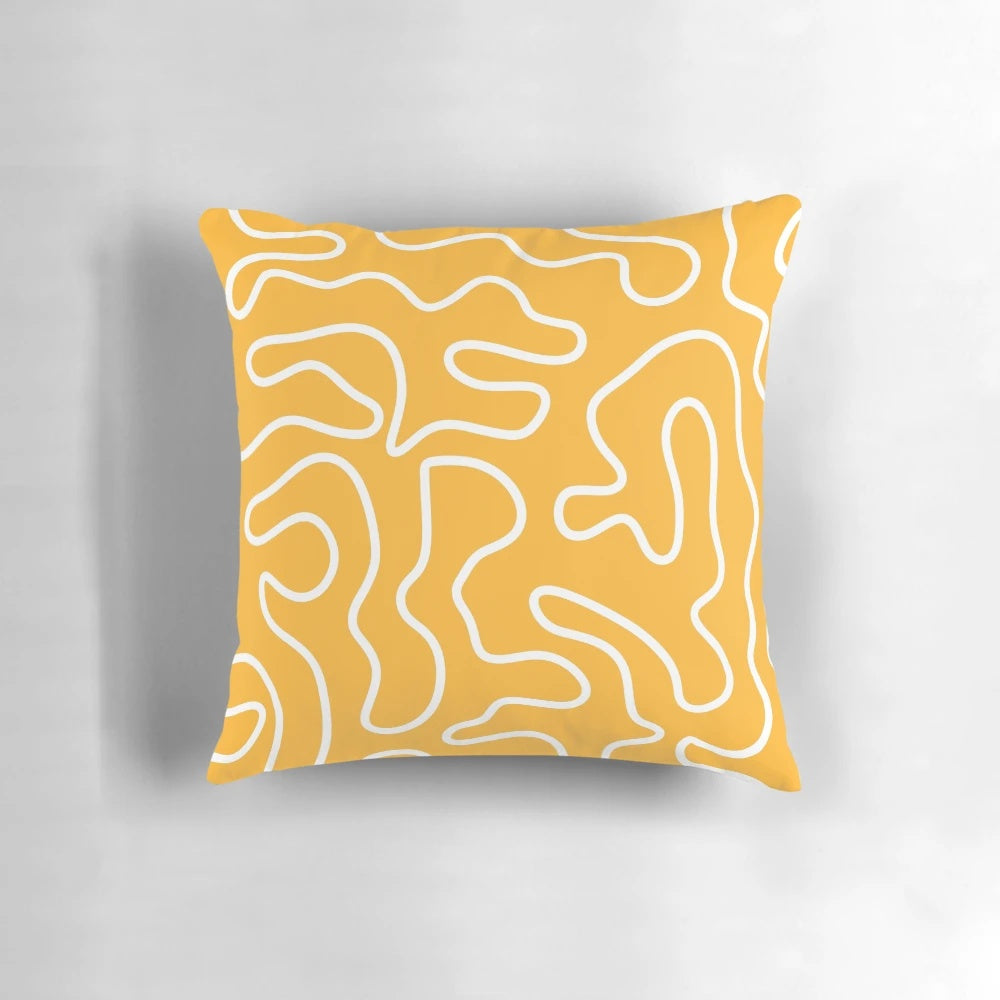 Minimalist abstract pattern pillow in a vibrant mustard yellow and white color scheme