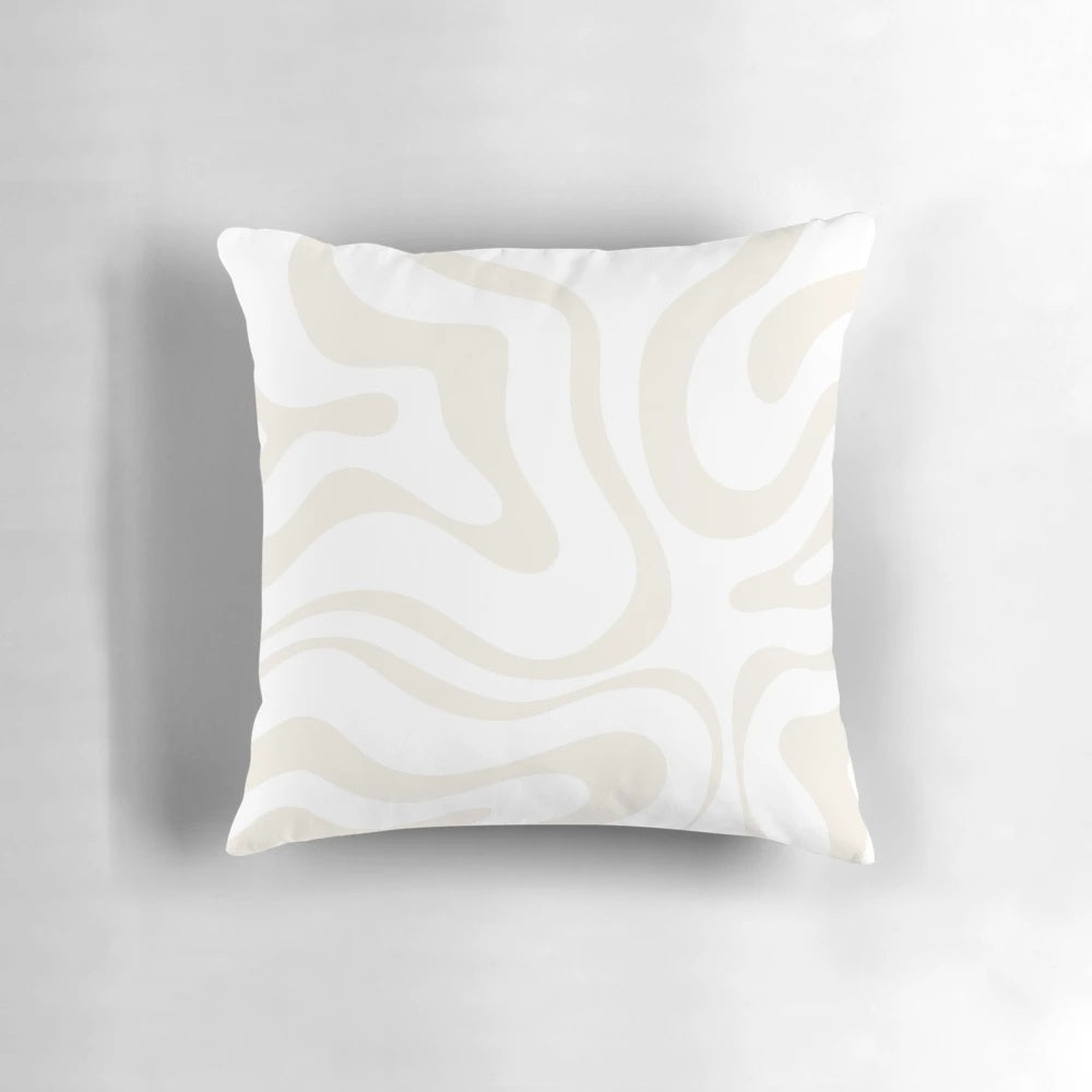 Soft, modern abstract pattern pillow in neutral white and beige tones