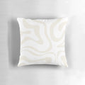 Soft, modern abstract pattern pillow in neutral white and beige tones