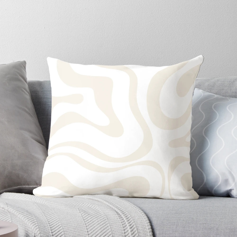 Soft, modern abstract pattern pillow in neutral white and beige tones
