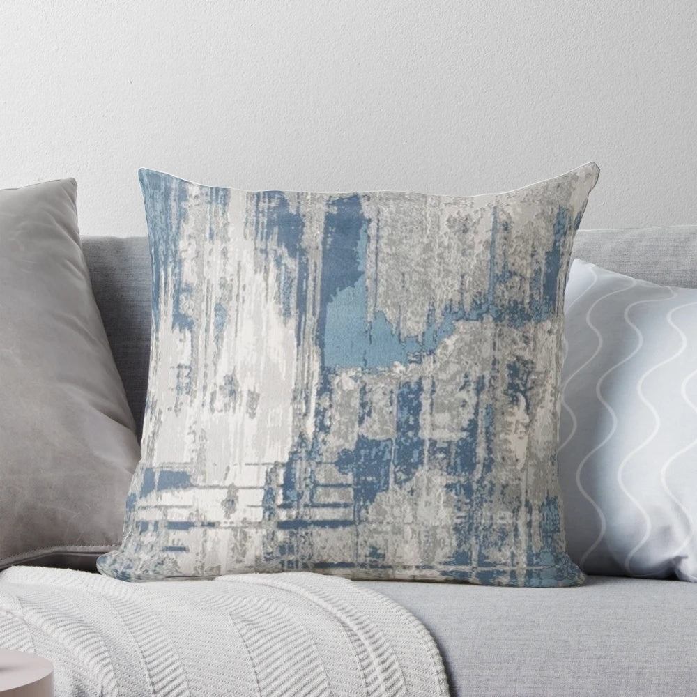 Minimalist abstract throw pillow in shades of teal, gray, and neutral colors with a textured, modern design.