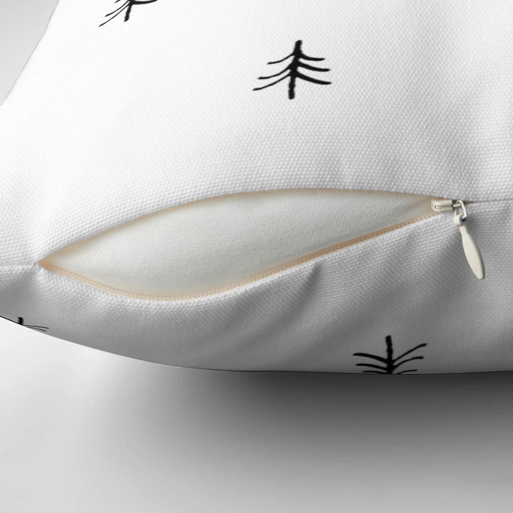 A minimalist black and white pattern Christmas pillow featuring a simple, handdrawn tree design