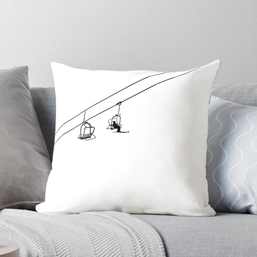 Black and white pillow featuring a minimalist ski lift design