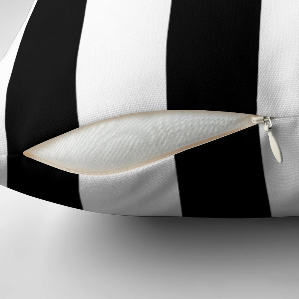 Minimalist modern black and white striped pillow with a simple line pattern design