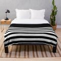 A black and white striped plush blanket for a minimalist and scandinavian-inspired home decor