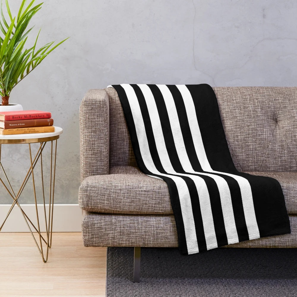A black and white striped plush blanket for a minimalist and scandinavian-inspired home decor