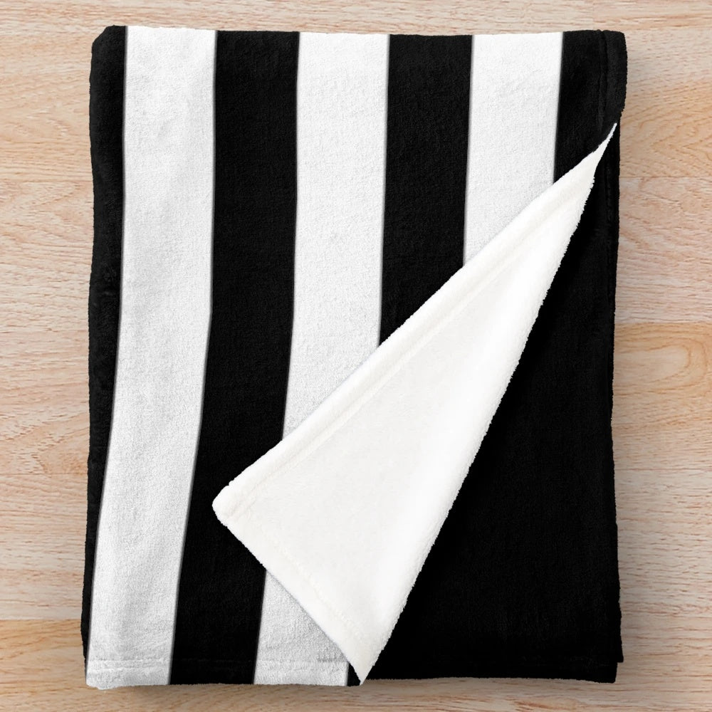 A black and white striped plush blanket for a minimalist and scandinavian-inspired home decor