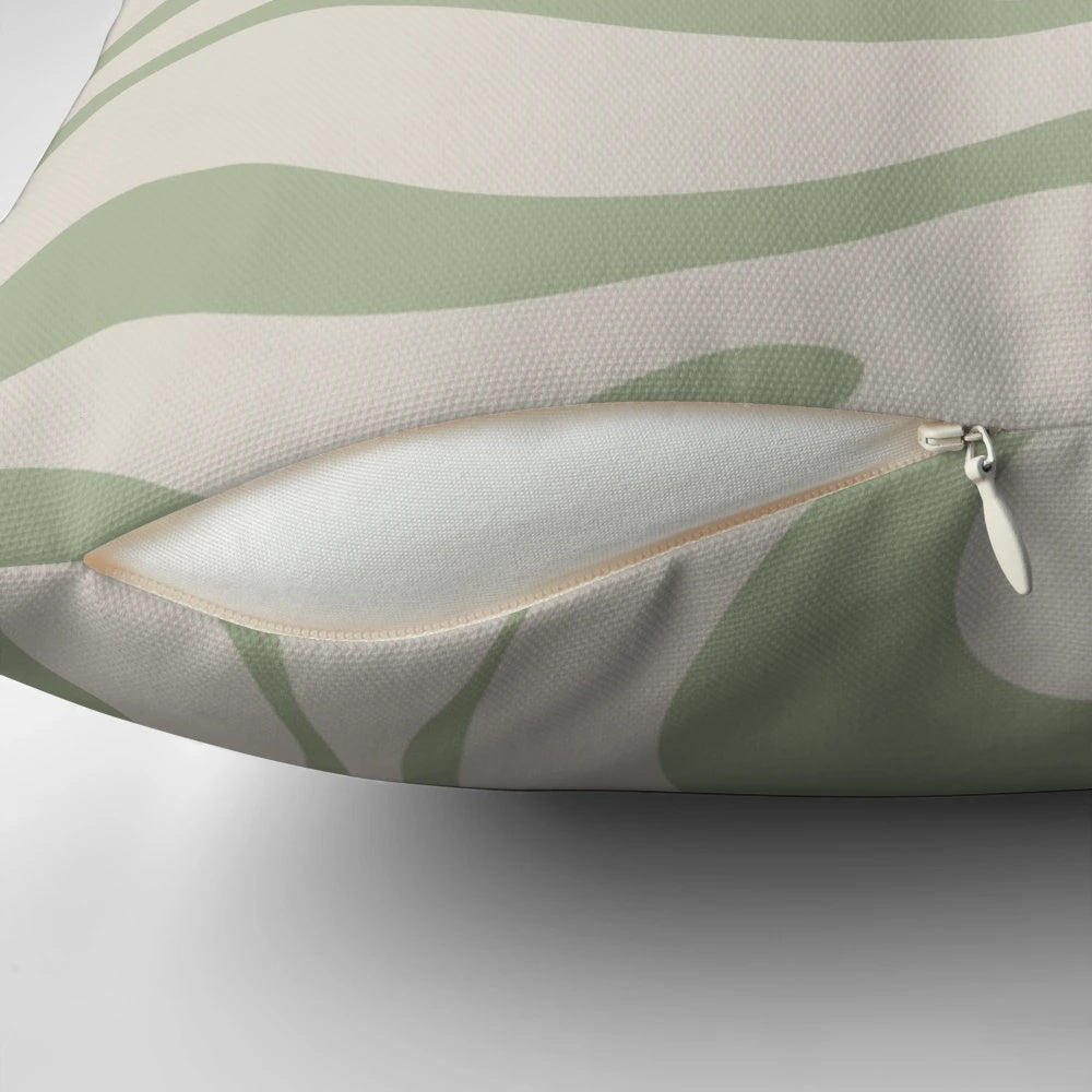 Minimalist abstract swirl pattern pillow in beige and sage green colors