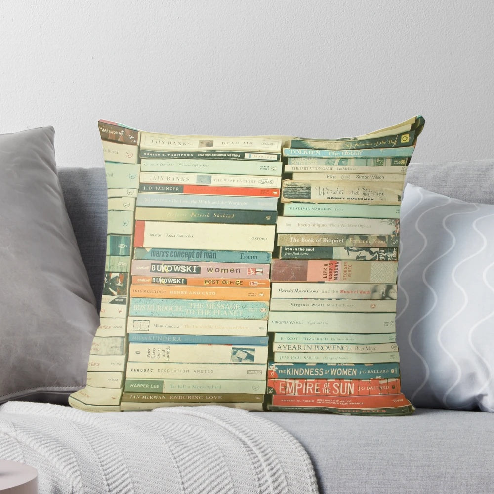 Decorative pillow featuring an abstract stack of book spines in a minimalist, modern design