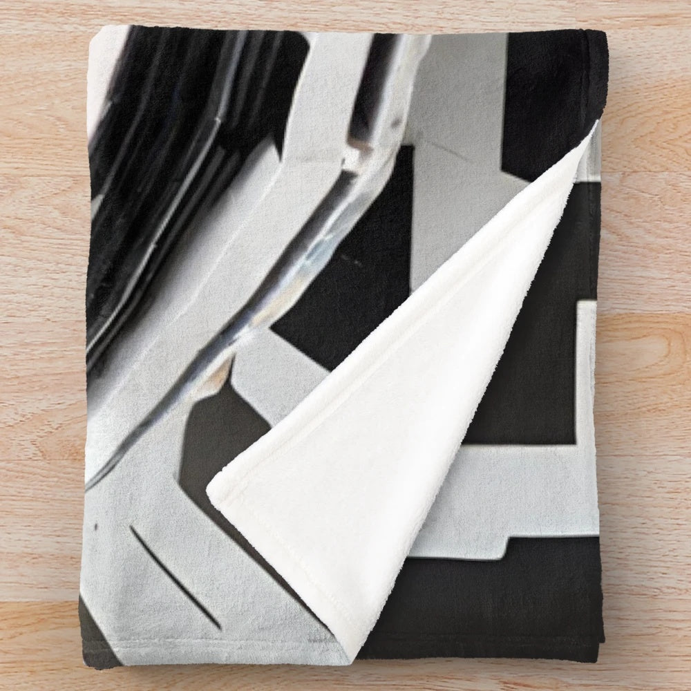 Minimalist car art design on a plush blanket