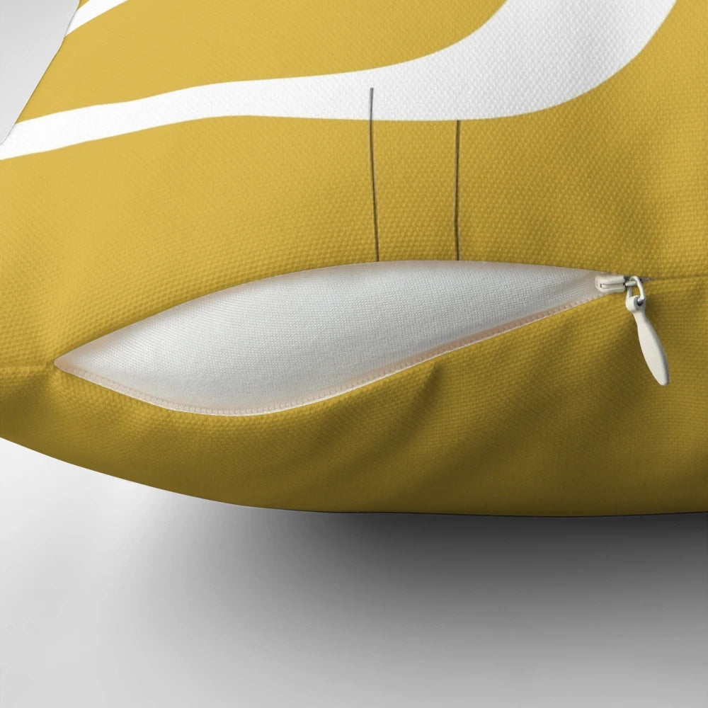 Minimalist coastal pillow featuring a pair of shorebirds in light mustard yellow and white
