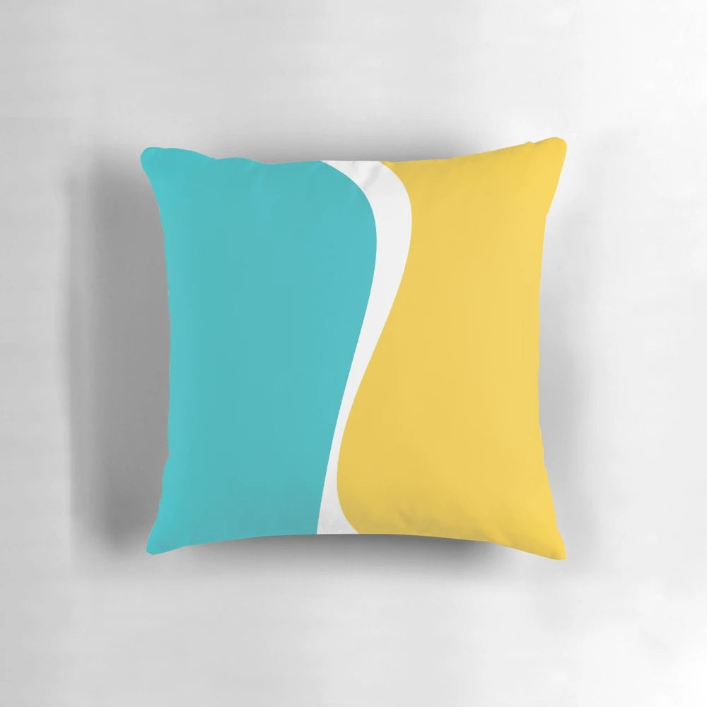 Soft, simple waves pillow in soothing turquoise and vibrant yellow color palette for a chic coastal vibe.