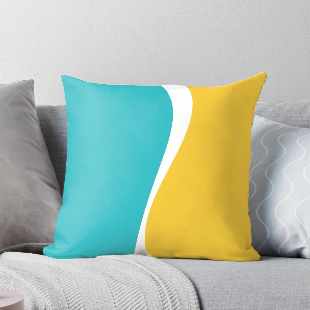Soft, simple waves pillow in soothing turquoise and vibrant yellow color palette for a chic coastal vibe.