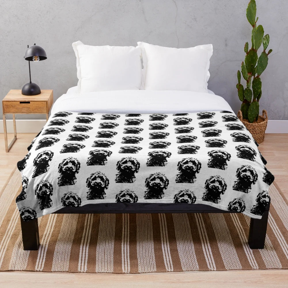 Minimalist black and white cockapoo illustration on a plush blanket