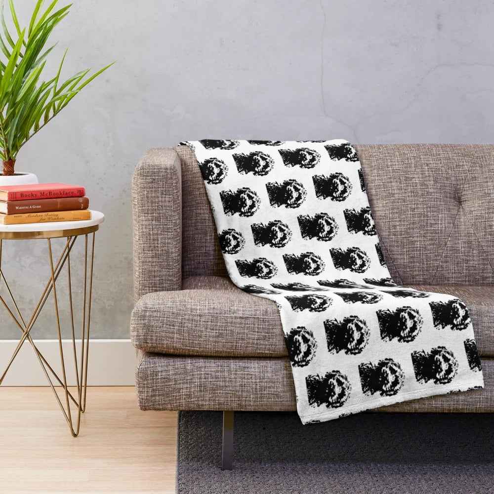 Minimalist black and white cockapoo illustration on a plush blanket