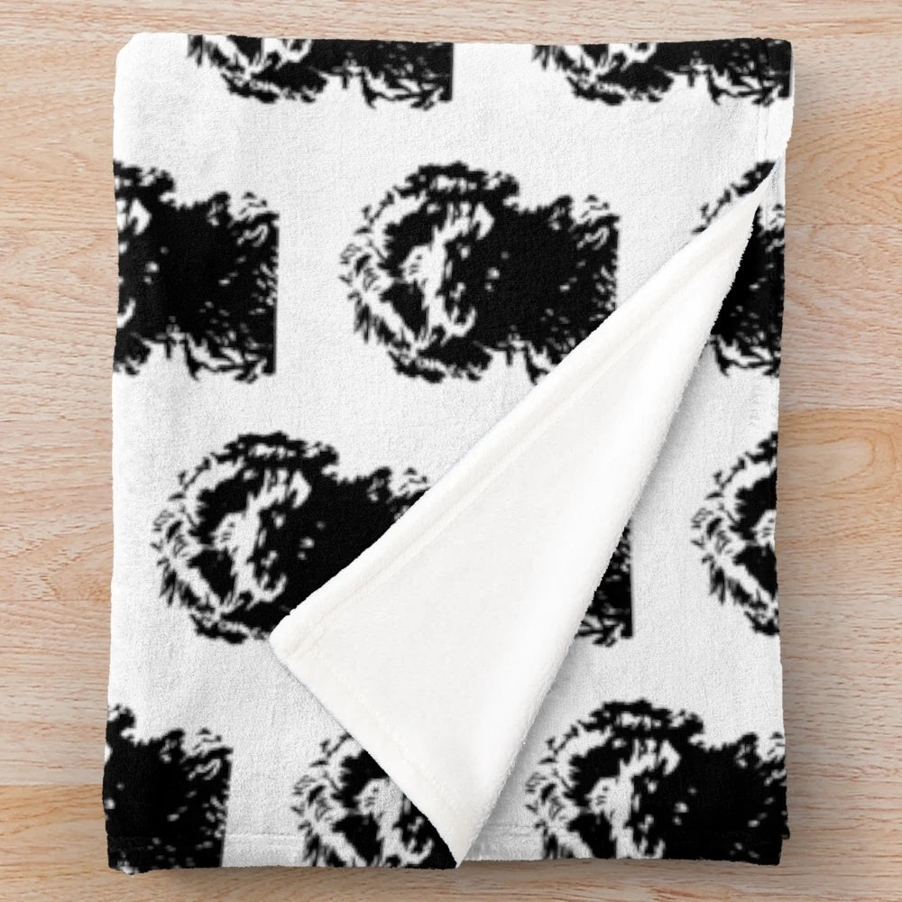 Minimalist black and white cockapoo illustration on a plush blanket