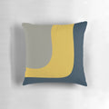 Minimalist color block pillow in a vibrant mustard, navy, and grey pattern.
