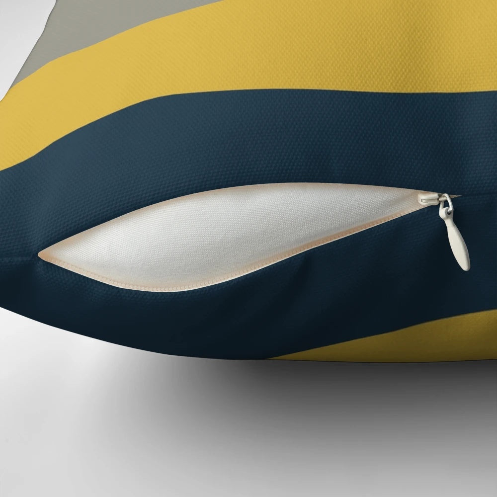 Minimalist color block pillow in a vibrant mustard, navy, and grey pattern.