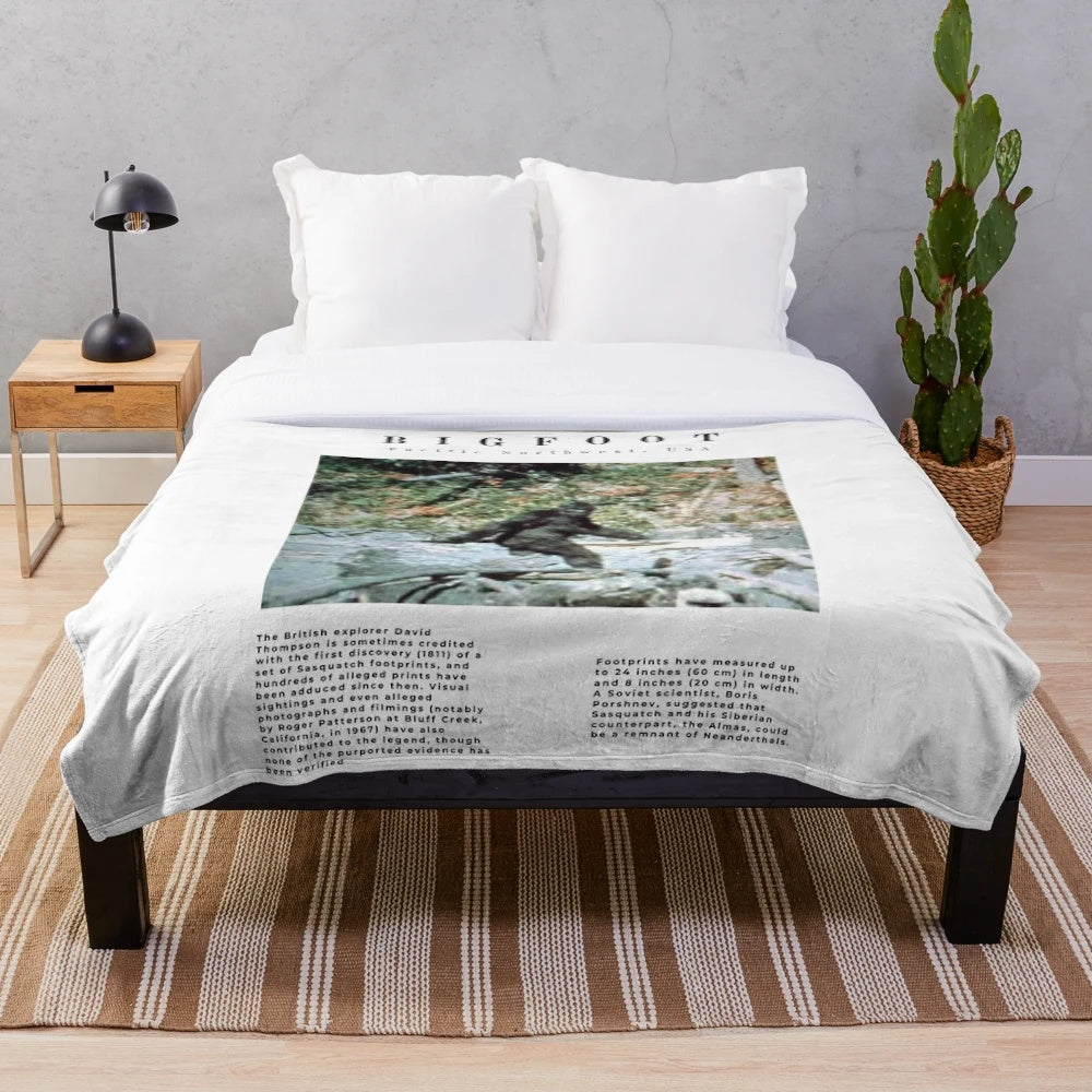 Minimalist Bigfoot plush blanket with a paranormal, supernatural aesthetic