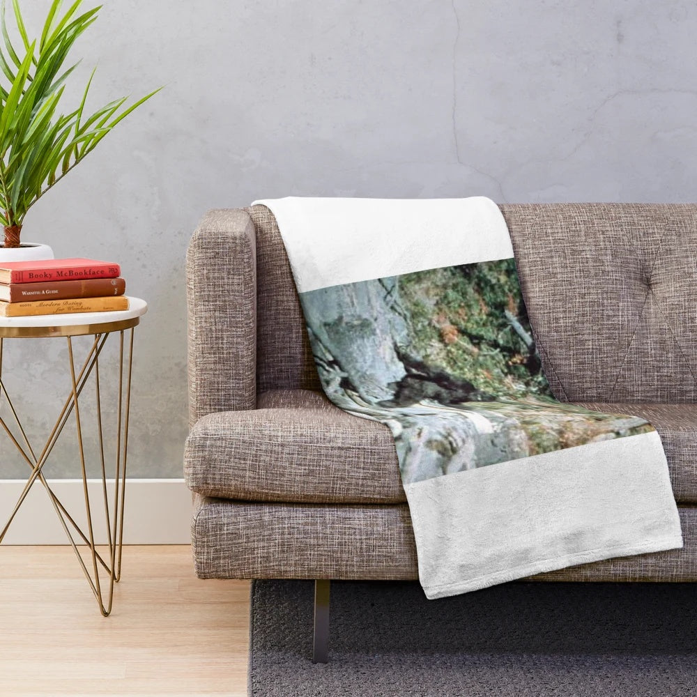 Minimalist Bigfoot plush blanket with a paranormal, supernatural aesthetic