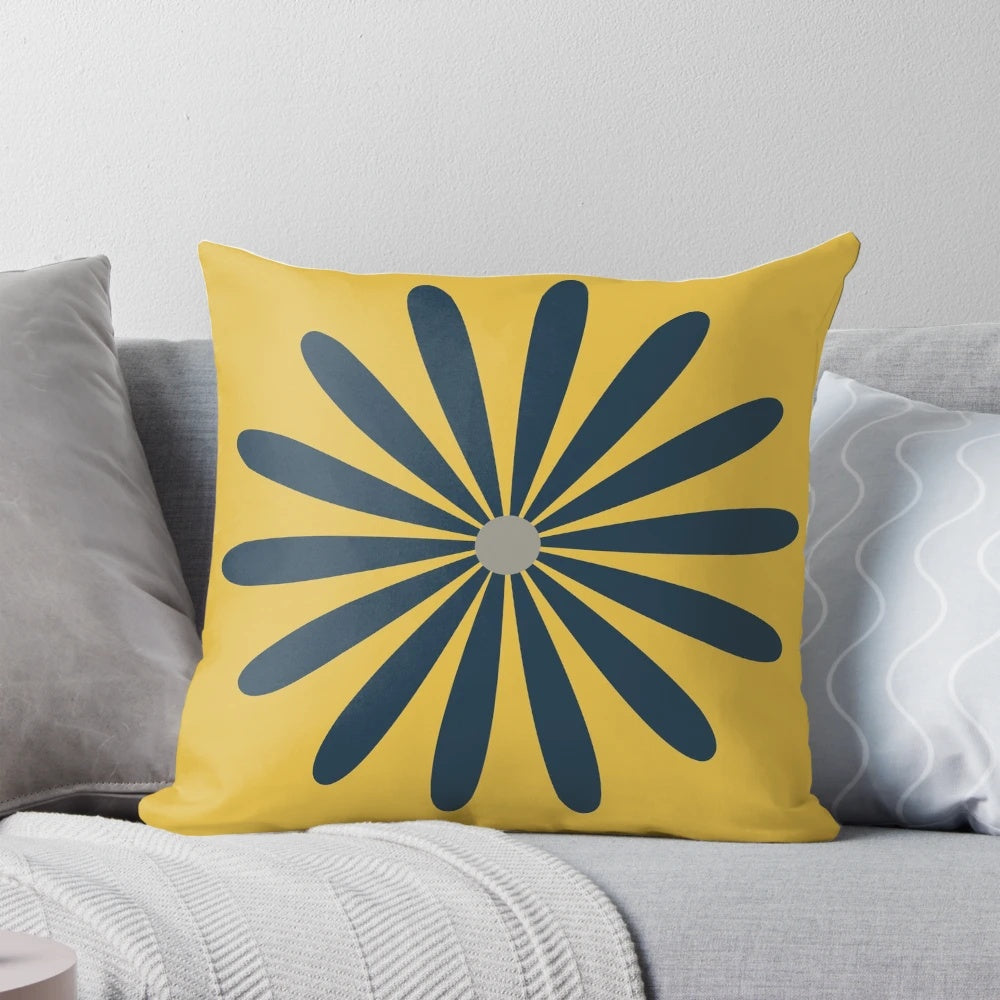 A minimalist, mid century modern geometric floral pillow in navy blue and yellow tones.