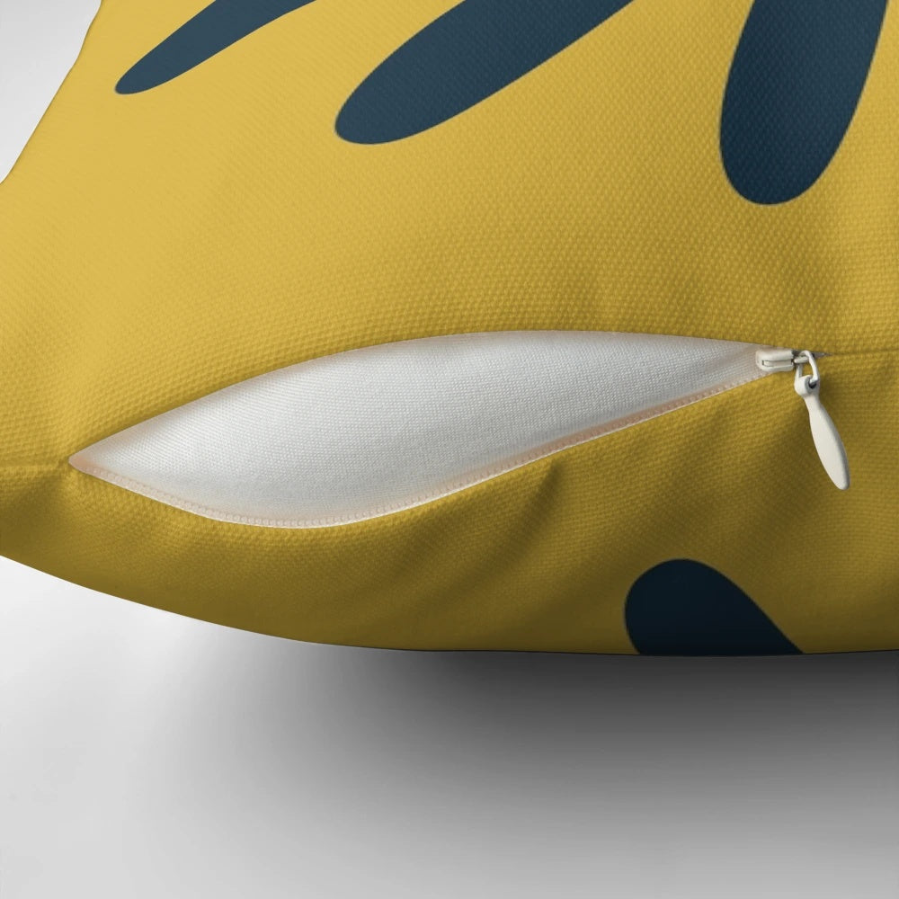 A minimalist, mid century modern geometric floral pillow in navy blue and yellow tones.