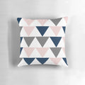 Minimalist geometric contemporary design pillow with a pattern of arrows in navy blue, charcoal grey, and blush pink on a white background