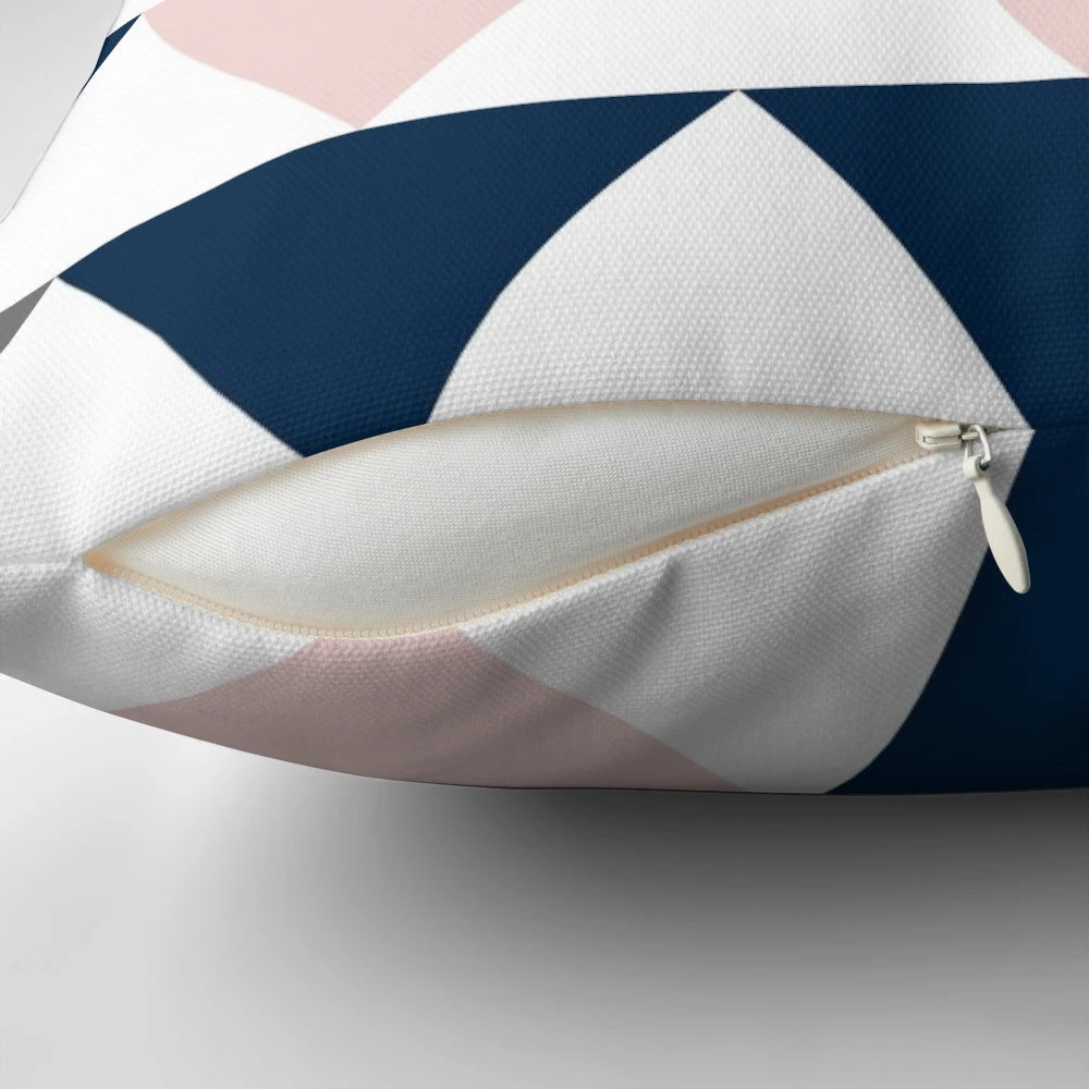 Minimalist geometric contemporary design pillow with a pattern of arrows in navy blue, charcoal grey, and blush pink on a white background