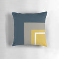 Minimalist geometric pattern pillow with a neutral color palette of mustard, navy, and gray.