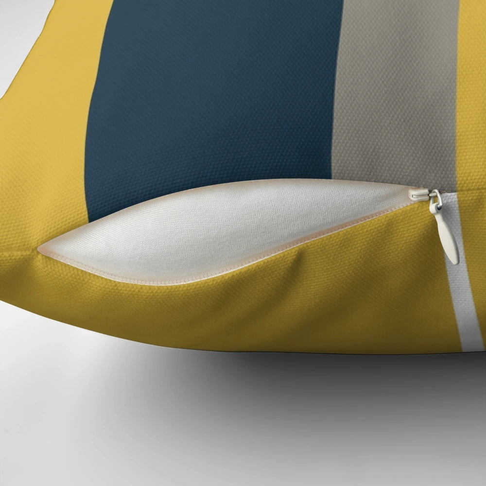 Minimalist geometric pattern pillow in mustard yellow, navy blue, grey, and white colors