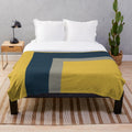 Minimalist geometric pattern plush blanket in mustard yellow, navy blue and grey