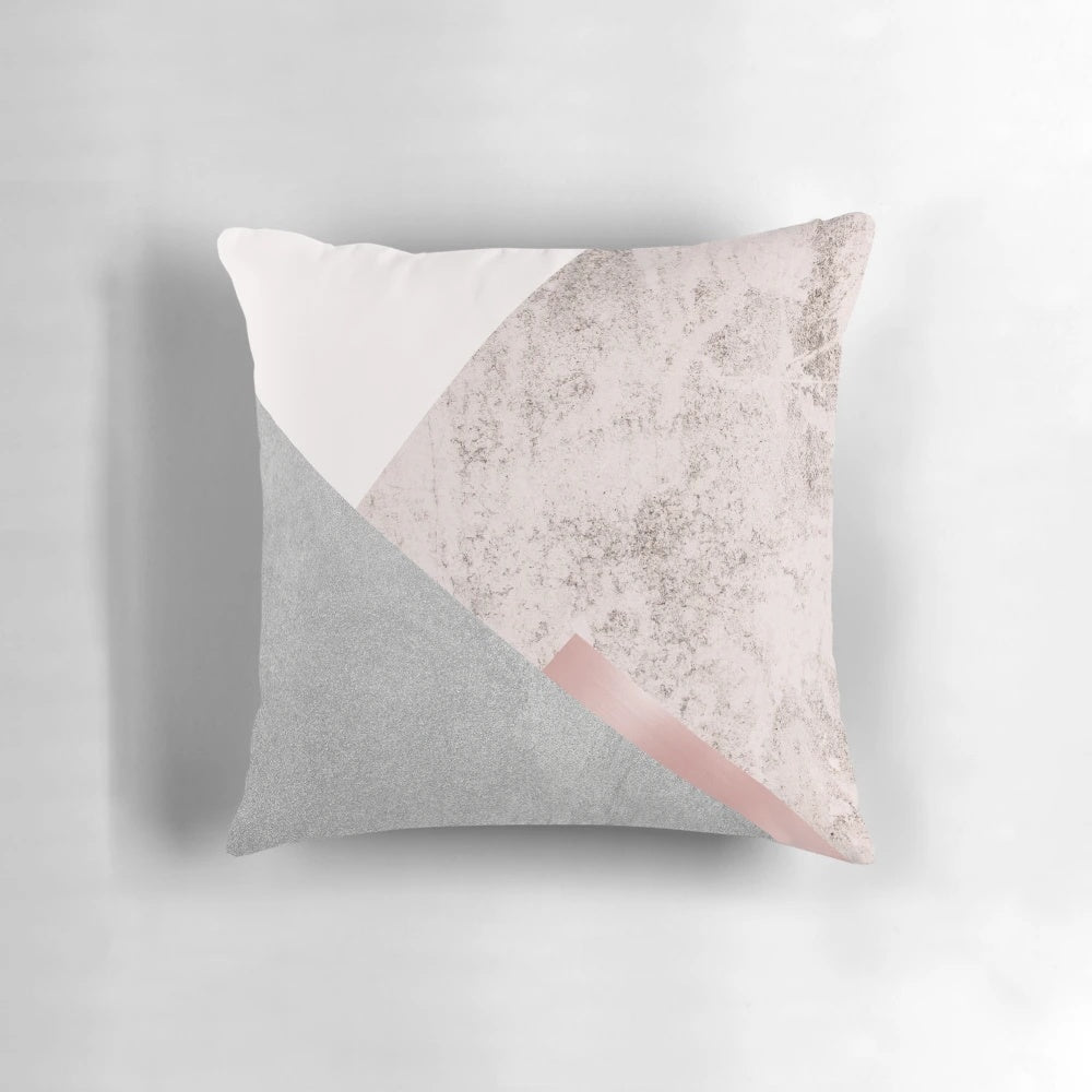 Minimalist, geometric pillow in pink and grey with scandinavian mountain design