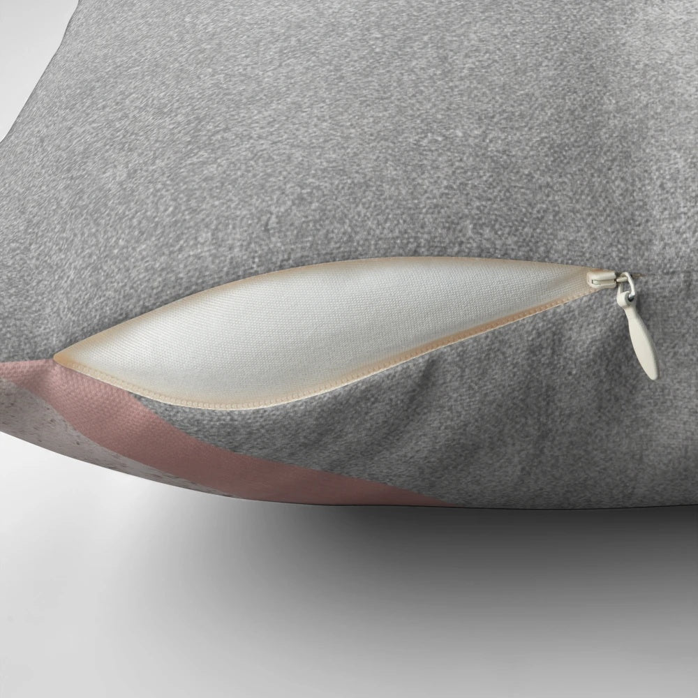 Minimalist, geometric pillow in pink and grey with scandinavian mountain design