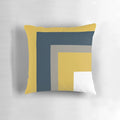 Minimalist geometric pattern pillow in mustard yellow, navy blue, and grey colors