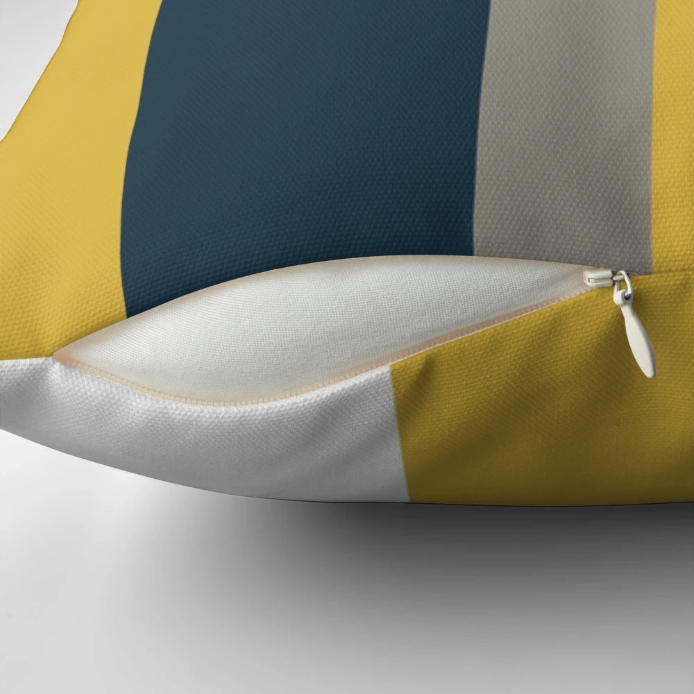 Minimalist geometric pattern pillow in mustard yellow, navy blue, and grey colors