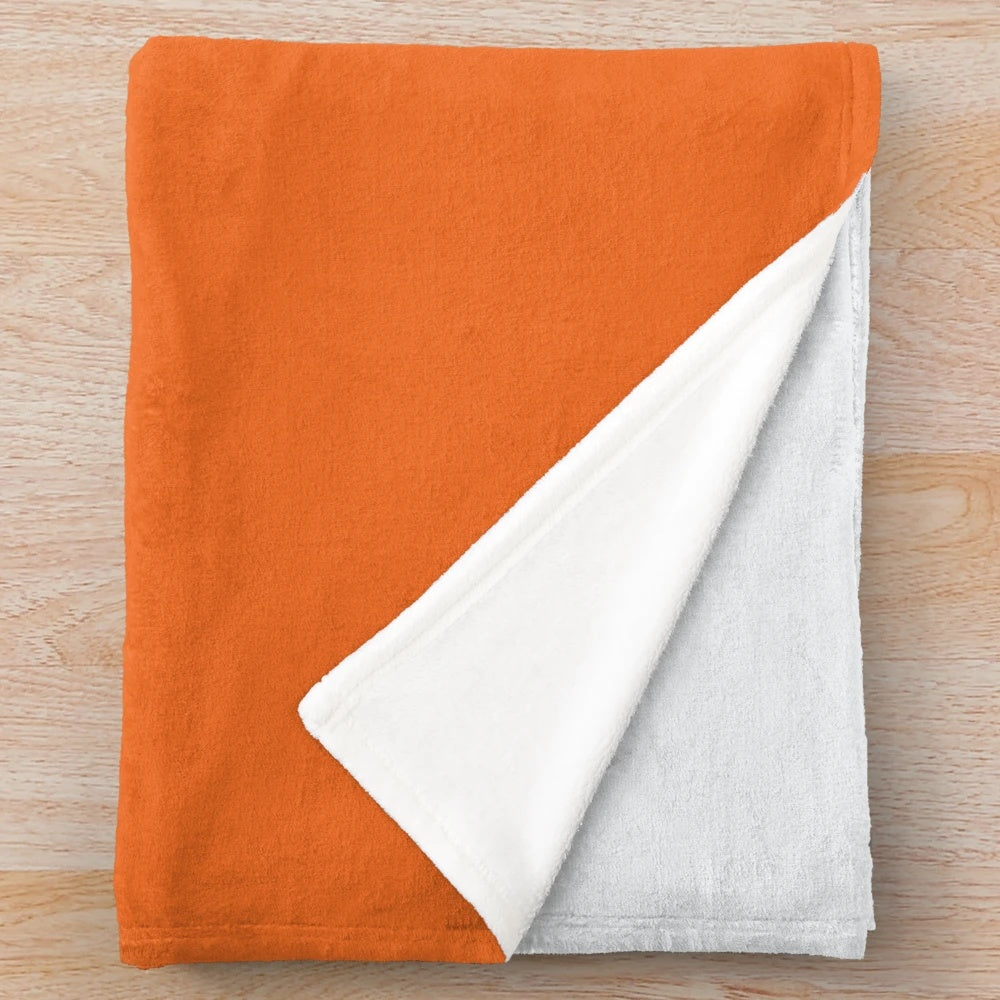 Grey orange and concrete color block plush blanket with geometric pattern