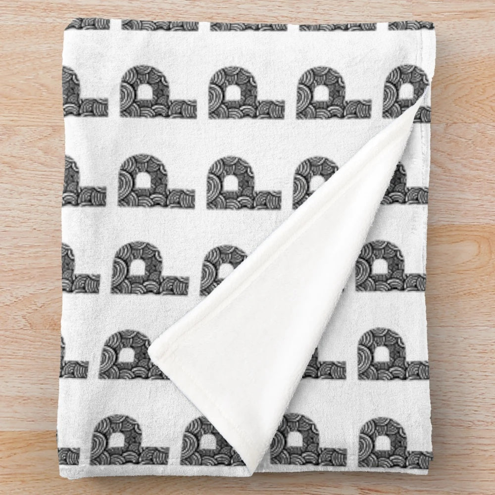 Cozy plush blanket featuring a modern letter P pattern in black and white