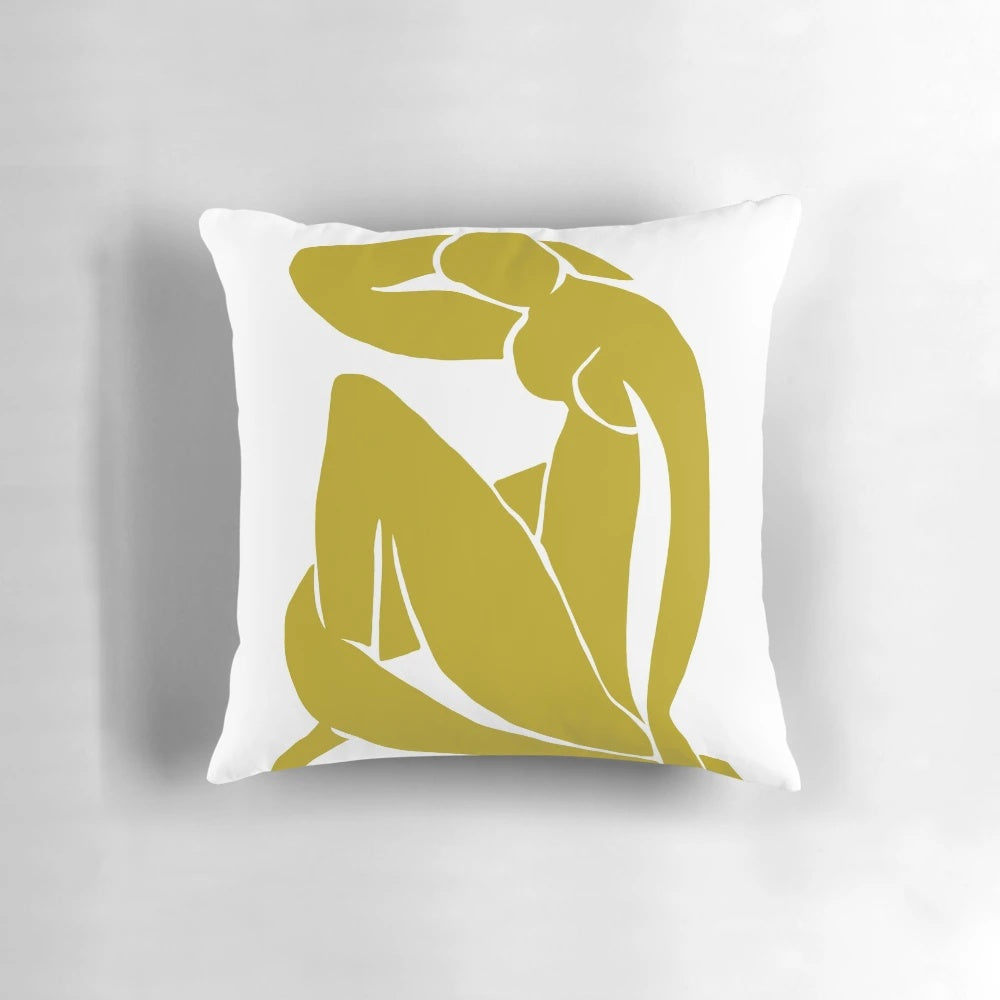 Mustard yellow pillow featuring a minimalist abstract figure inspired by the artwork of Henri Matisse