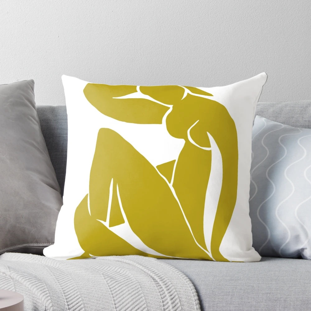 Mustard yellow pillow featuring a minimalist abstract figure inspired by the artwork of Henri Matisse