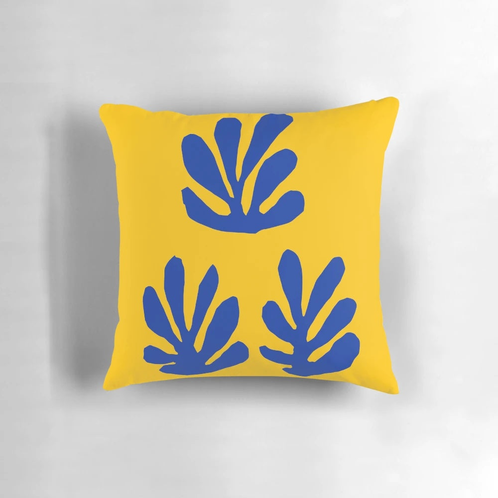 Minimalist abstract art pillow featuring a blue and yellow design inspired by the works of Henri Matisse