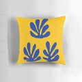 Minimalist abstract art pillow featuring a blue and yellow design inspired by the works of Henri Matisse