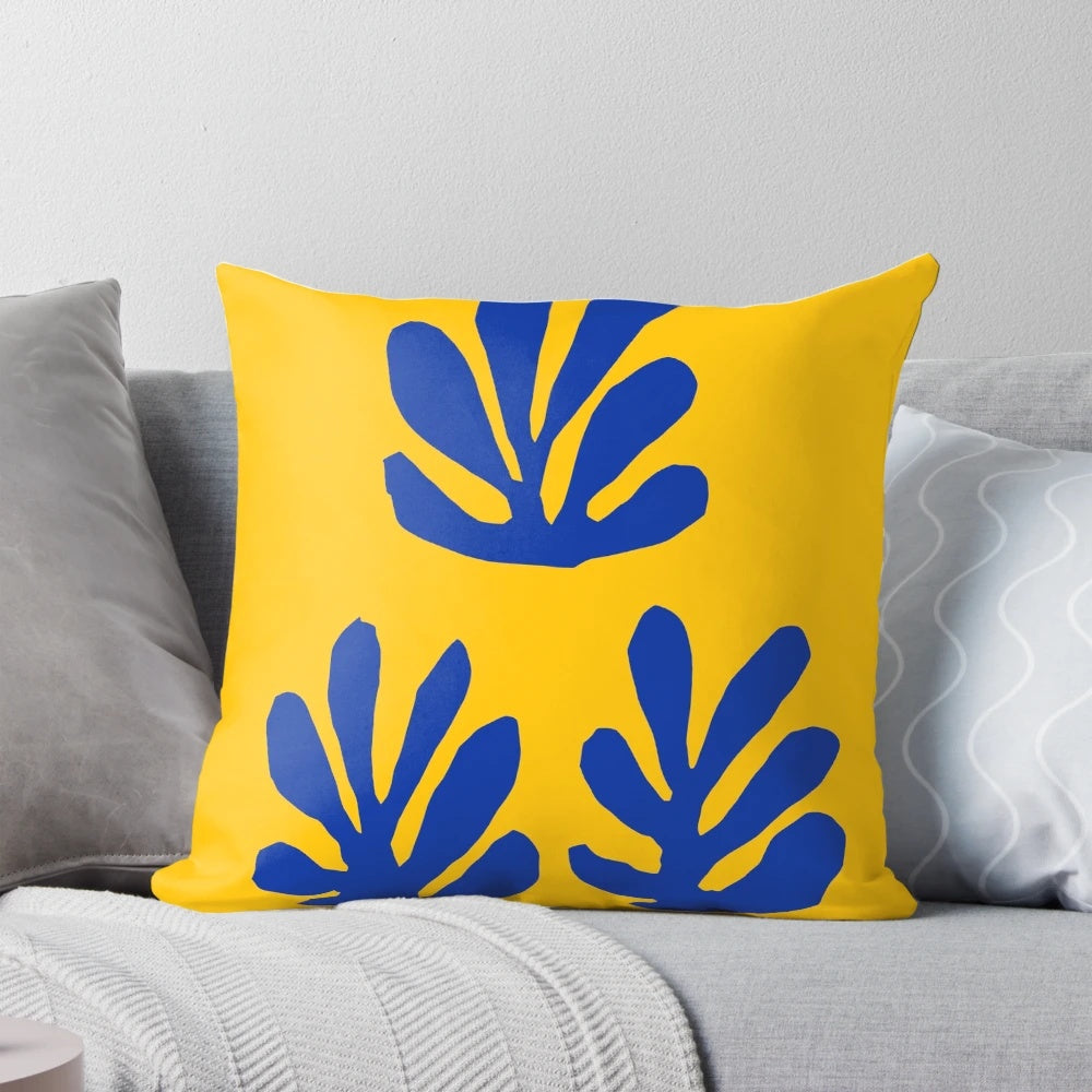 Minimalist abstract art pillow featuring a blue and yellow design inspired by the works of Henri Matisse