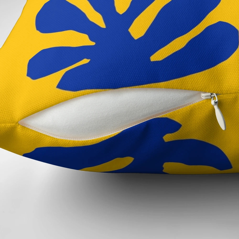 Minimalist abstract art pillow featuring a blue and yellow design inspired by the works of Henri Matisse