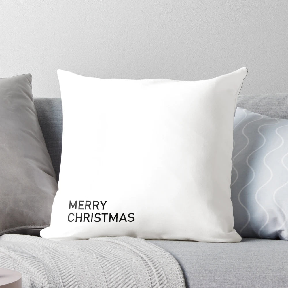 Minimalist black and white "Merry Christmas" text design on a decorative holiday pillow