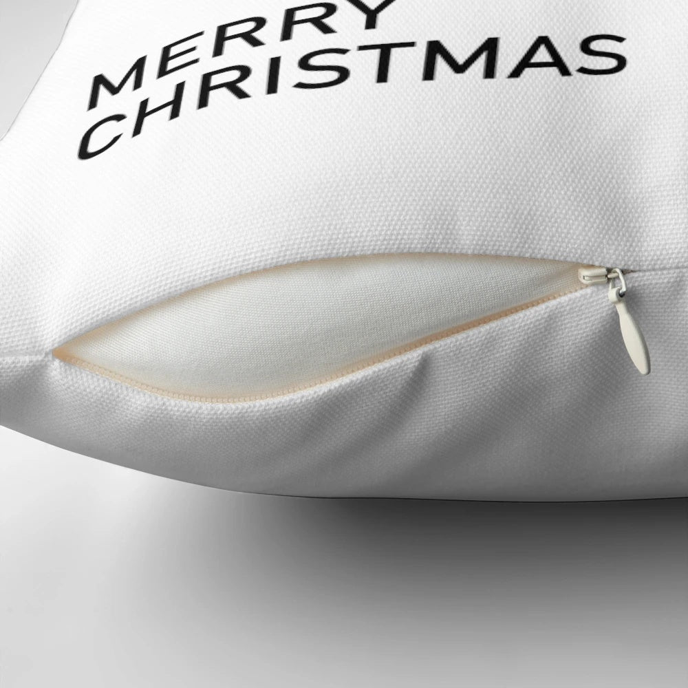 Minimalist black and white "Merry Christmas" text design on a decorative holiday pillow