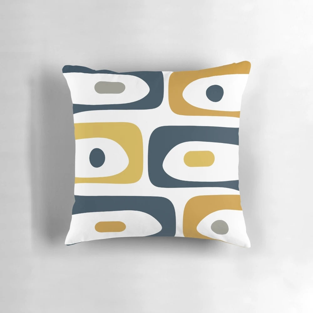 Minimalist mid century modern style pillow with an abstract pattern in navy blue, mustard, grey, and white