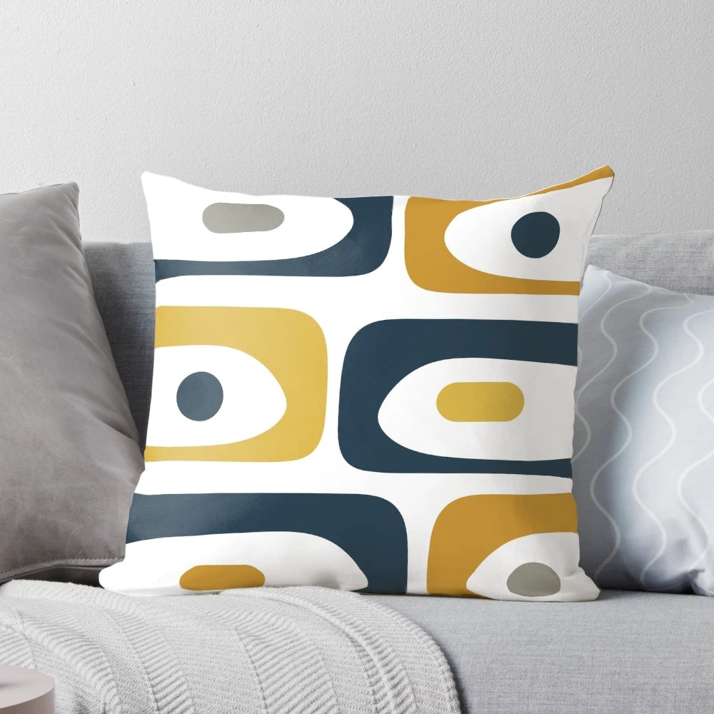 Minimalist mid century modern style pillow with an abstract pattern in navy blue, mustard, grey, and white