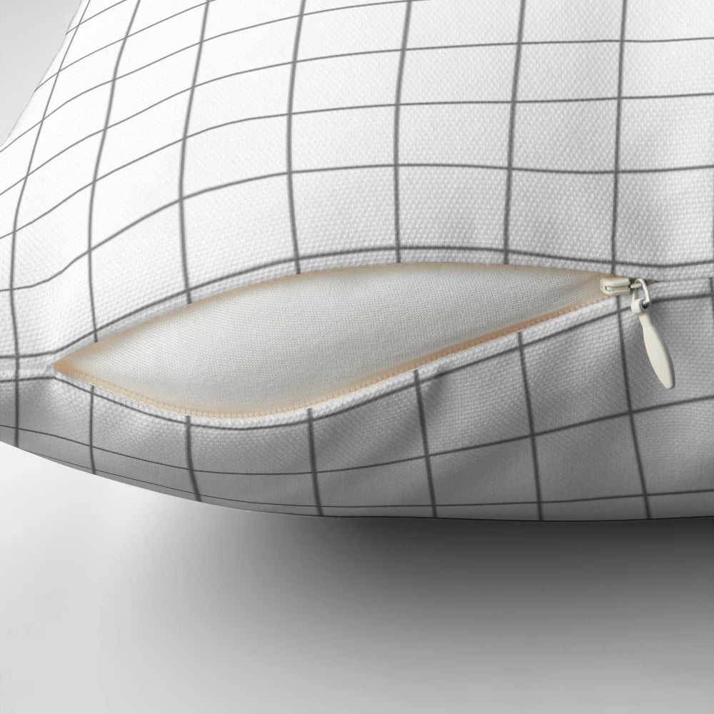 Minimalist and modern square pillow in a grid pattern with white and gray colors